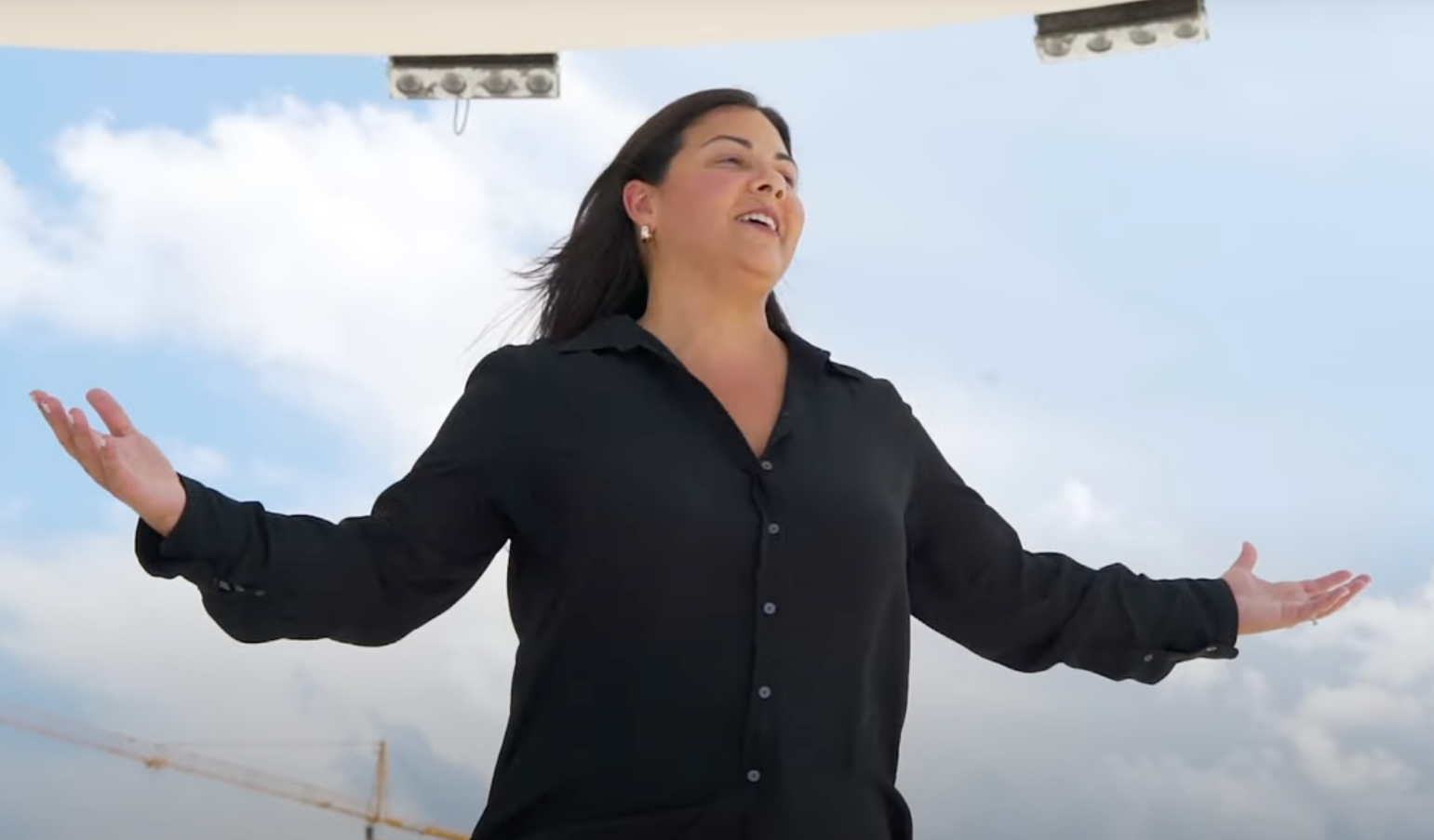 Cecilia Gonzalez performing on stage on the Coral Gables University of Miami Campus. 