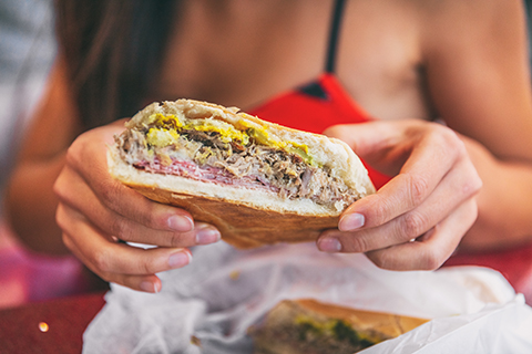 An up close stock photo of a traditional Cuban sandwich.