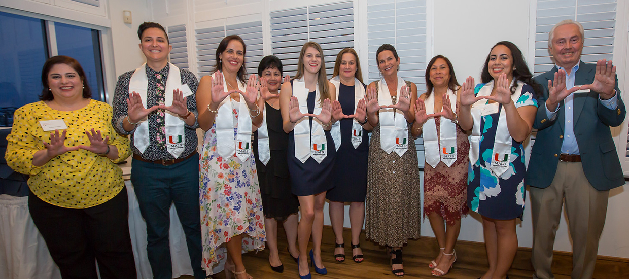 A photo of MALS graduates at a graduation reception.