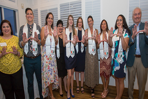 A photo of MALS graduates at a graduation reception.