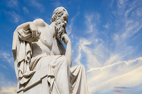 A stock photo of a statue of the "thinking man."